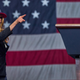Meryl Streep in front of the US Flag in a hat that says "dont look up"